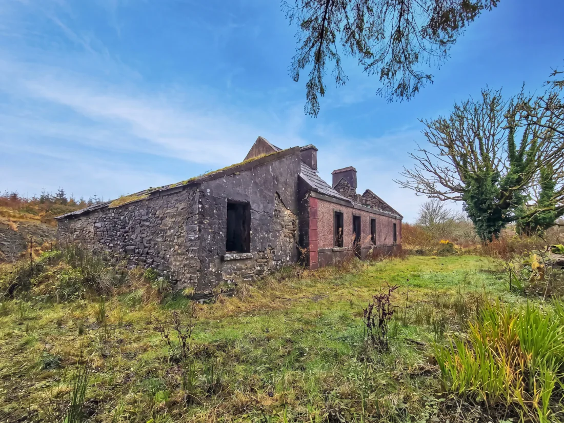 A vacant traditional stone and rendered house awaiting refurbishment